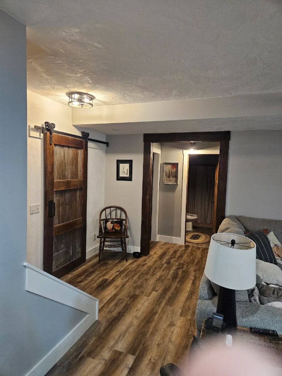 Finished basement hallway with lighting installed by RP Electric